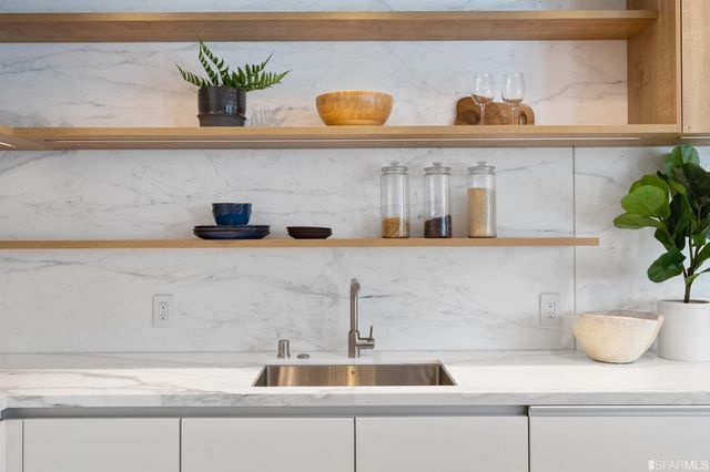 a spacious bedroom with a bed and a couch