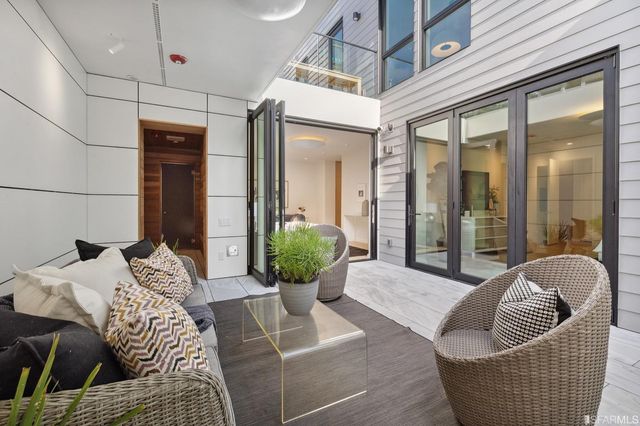 a front view of a residential apartment building with a yard