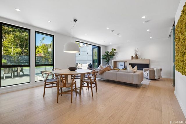 a view of a dining room with furniture window and outside view