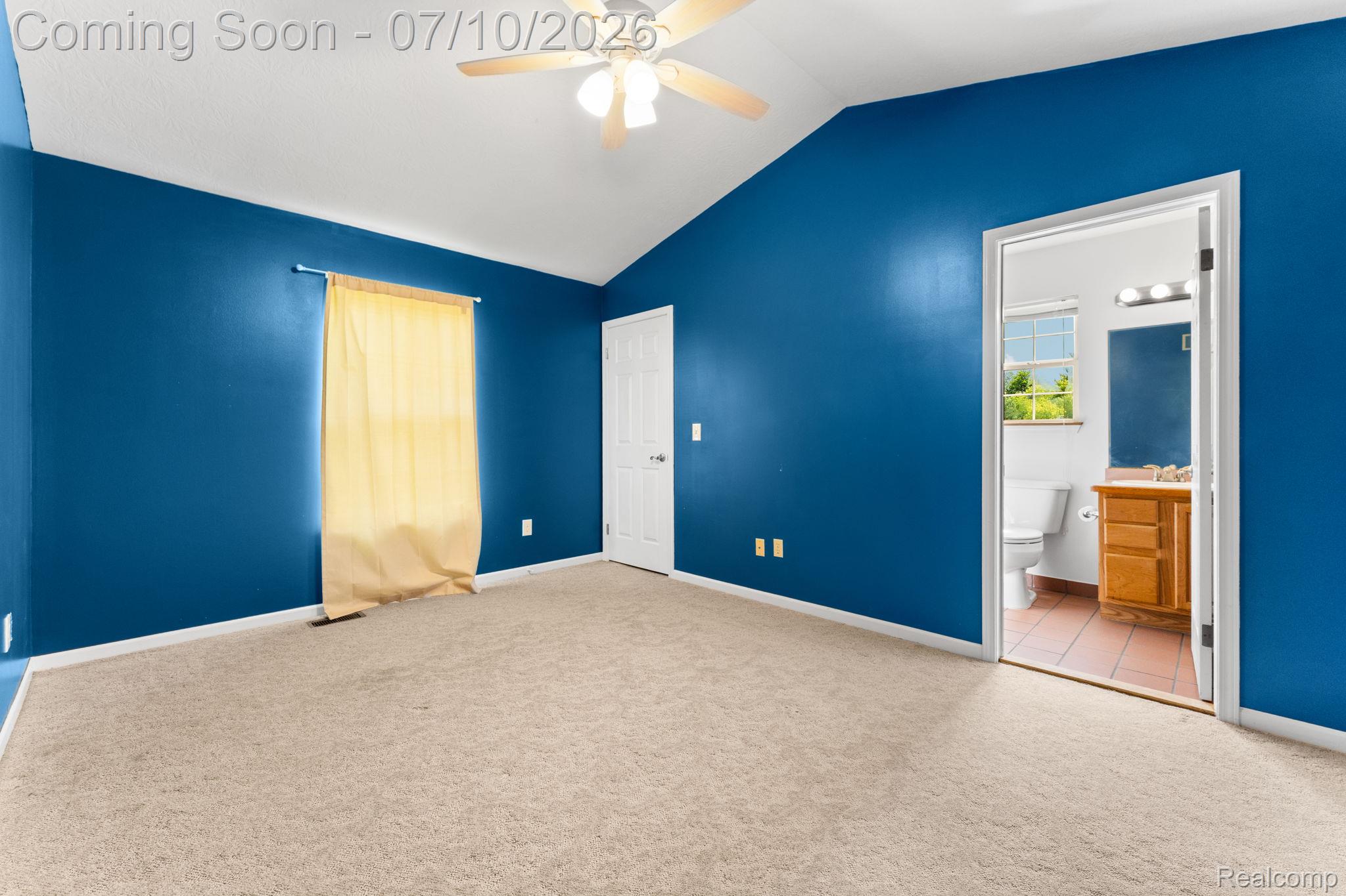 3144 North Nicholson Road Fowlerville, MI 48836 - Photo 52 of 70 Carpeted room featuring a vaulted ceiling and a ceiling fan with light fixture