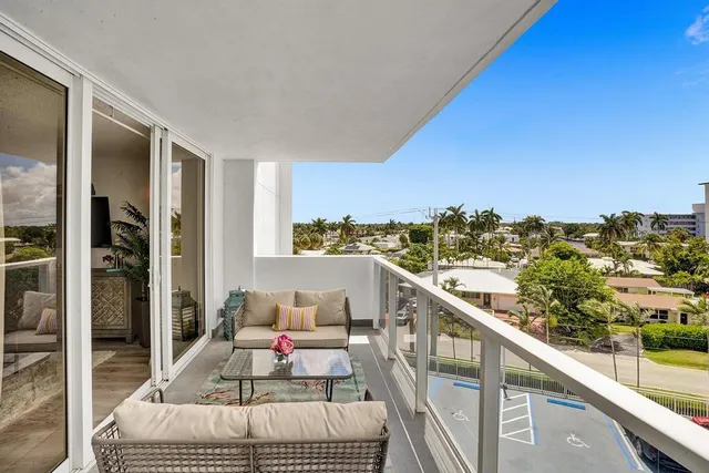 a view of balcony with furniture
