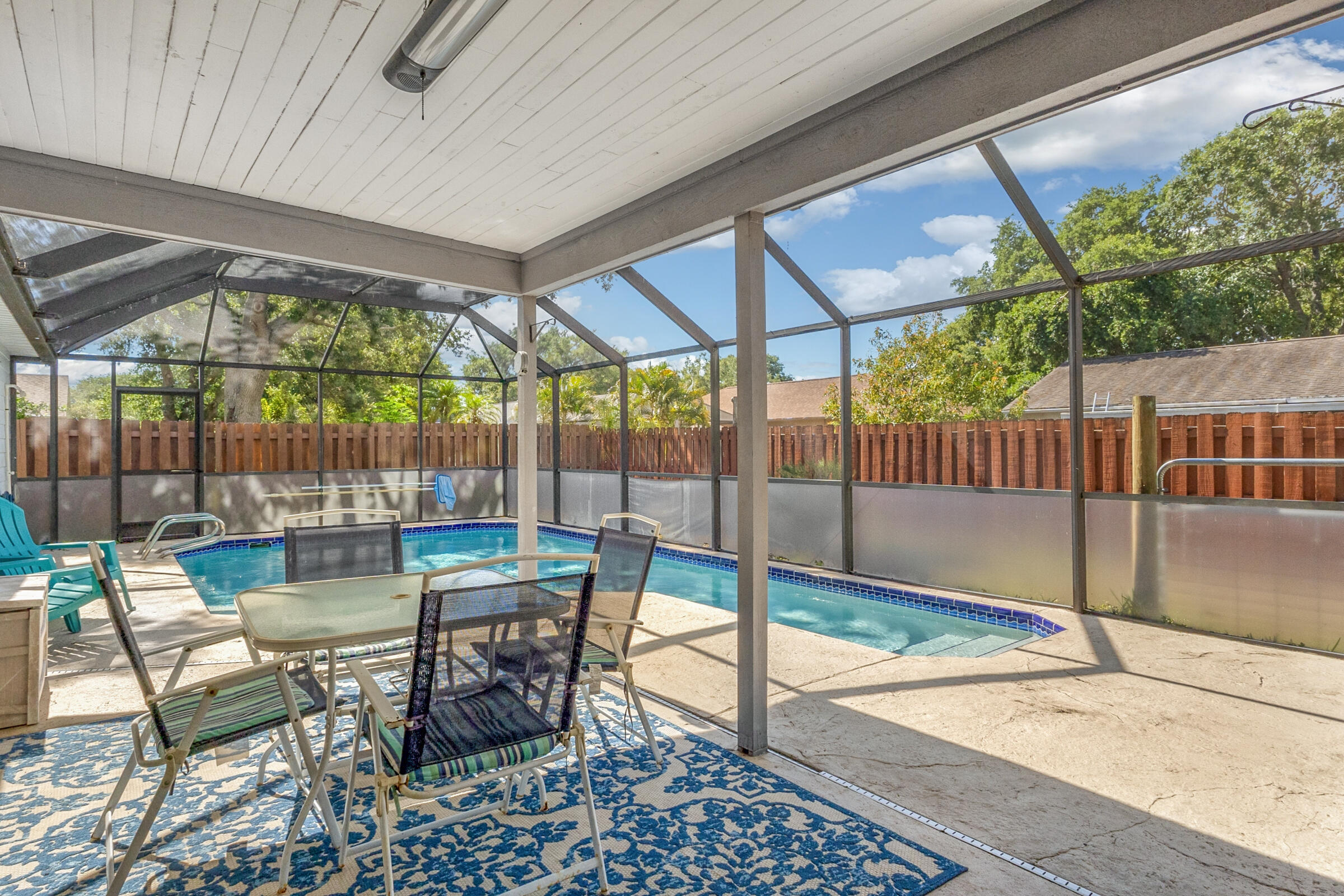 141 Crystal Lake Road Melbourne, FL 32901 - Photo 20 of 44 a view of a patio with a table chairs and backyard