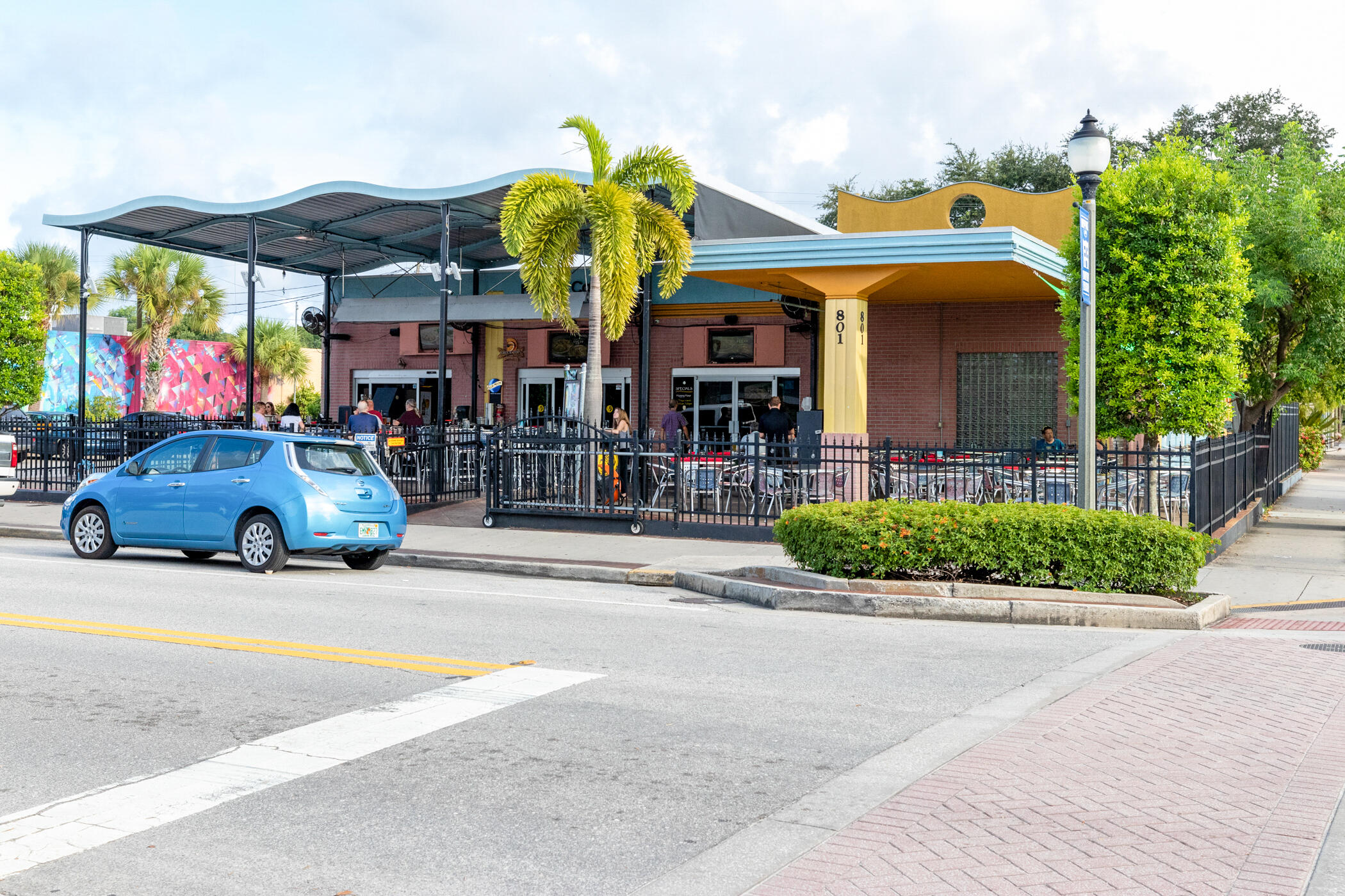 141 Crystal Lake Road Melbourne, FL 32901 - Photo 44 of 44 a view of a cafe with a table and chairs under an umbrella