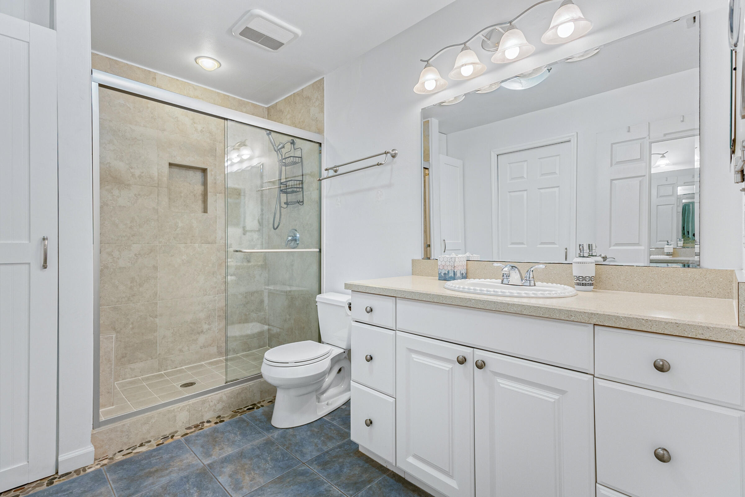 141 Crystal Lake Road Melbourne, FL 32901 - Photo 9 of 44 a bathroom with a double vanity sink toilet and shower