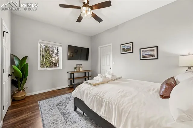 a bathroom with a toilet a sink and a mirror