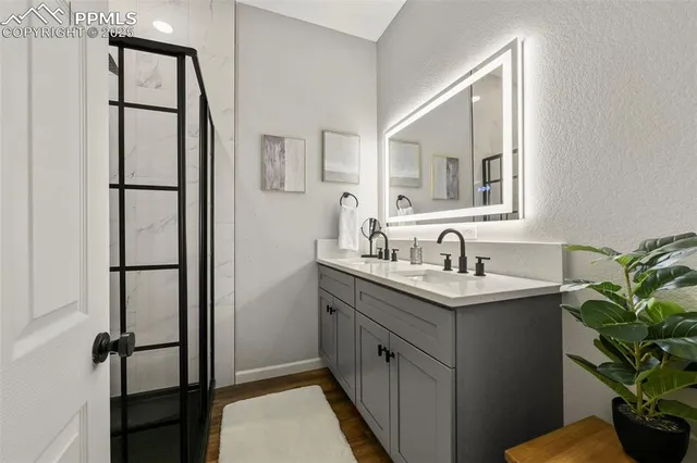 a bedroom with a bed a fireplace and windows