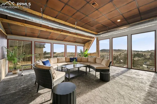 a view of a balcony with chairs