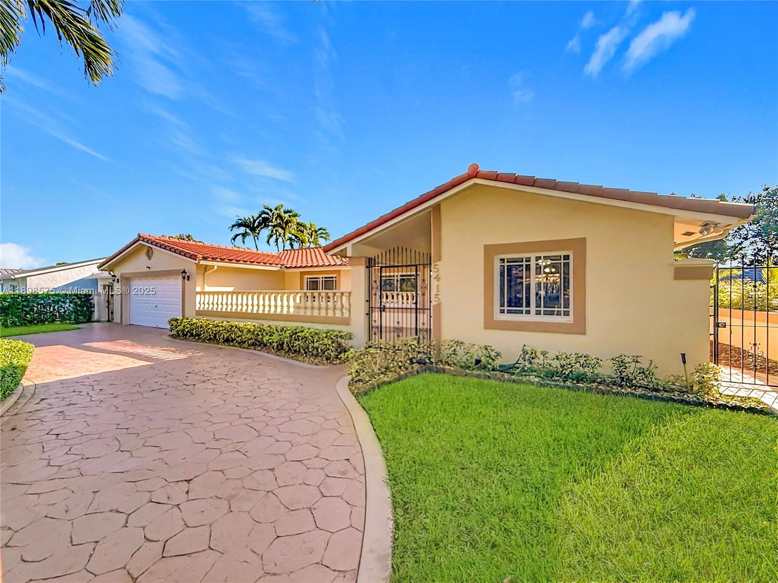 5415 Southwest 135th Court Miami, FL 33175 - Photo 3 of 28 a front view of a house with a garden