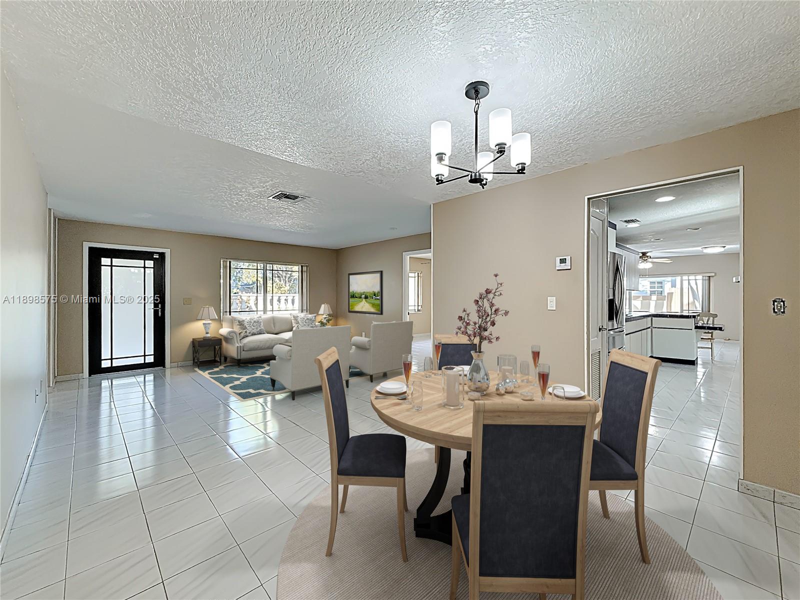 5415 Southwest 135th Court Miami, FL 33175 - Photo 4 of 28 a view of a dining room with furniture and chandelier