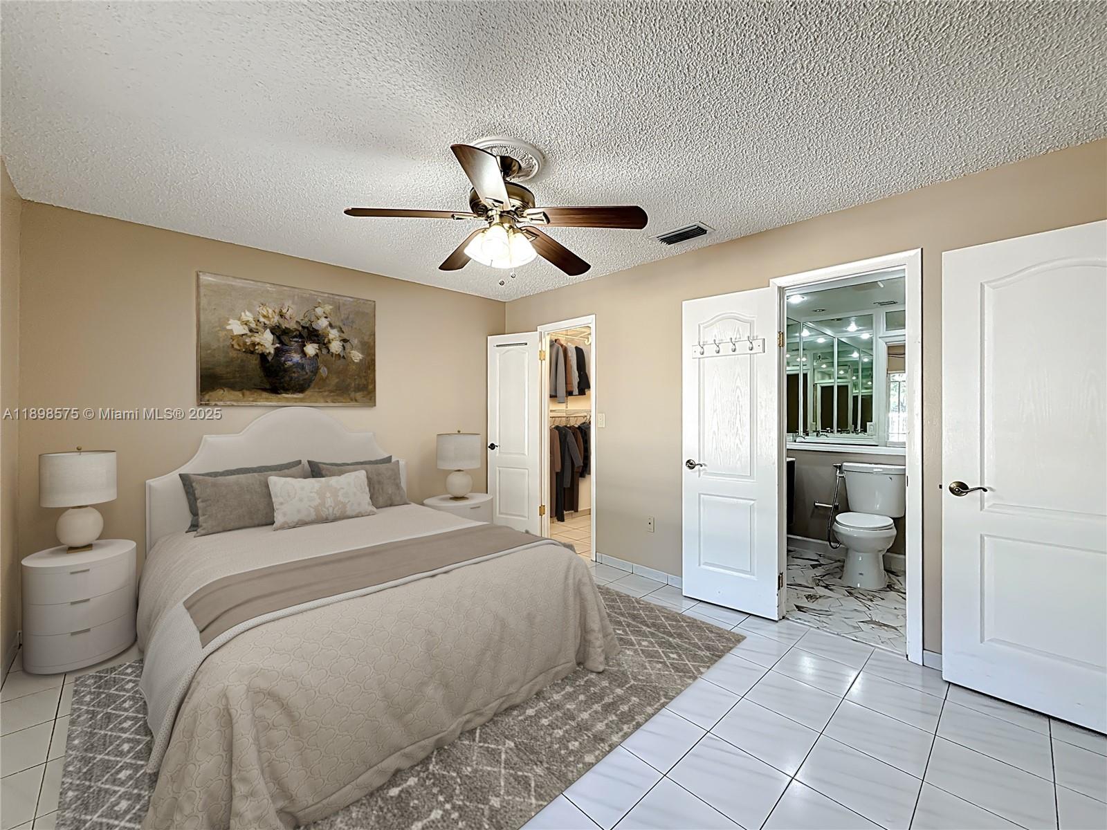 5415 Southwest 135th Court Miami, FL 33175 - Photo 6 of 28 a bedroom with a large bed chandelier and a window