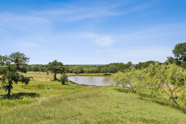 a view of lake with green space