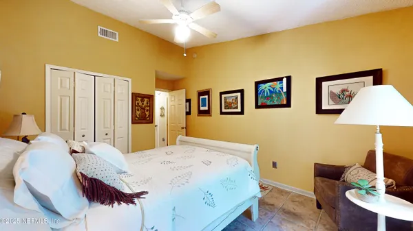 a bed room with a bed and a couch