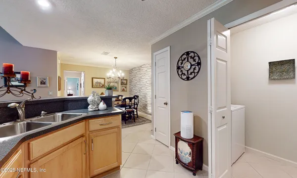 a kitchen with stainless steel appliances a sink stove and microwave