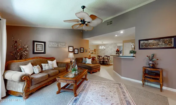 a kitchen with stainless steel appliances granite countertop a stove a refrigerator and a microwave