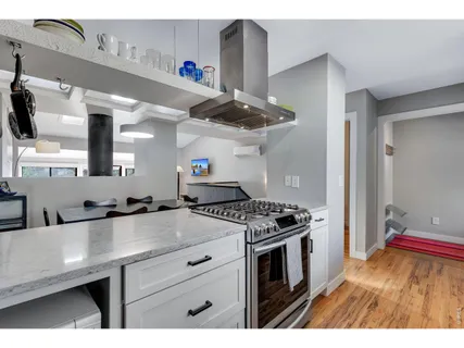 a kitchen with a stove and a sink