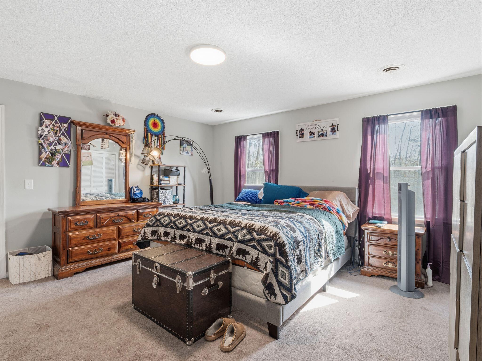 90 Fall Drive Collinsville, VA 24078 - Photo 13 of 22 a bedroom with a bed and a dresser