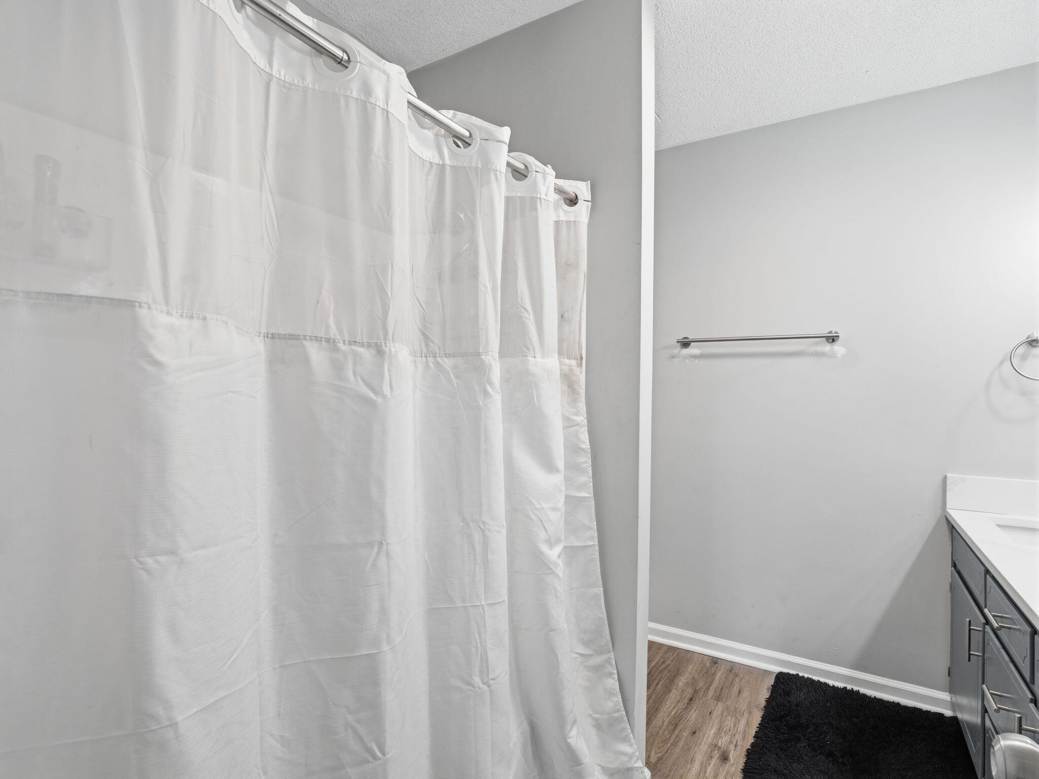 90 Fall Drive Collinsville, VA 24078 - Photo 14 of 22 a bathroom with a shower and a curtain