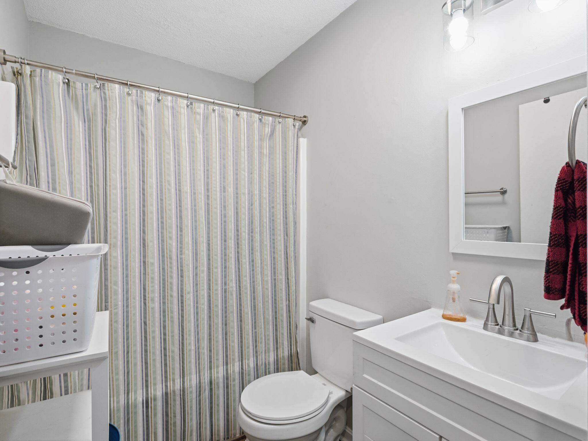 90 Fall Drive Collinsville, VA 24078 - Photo 15 of 22 a bathroom with a sink toilet and shower