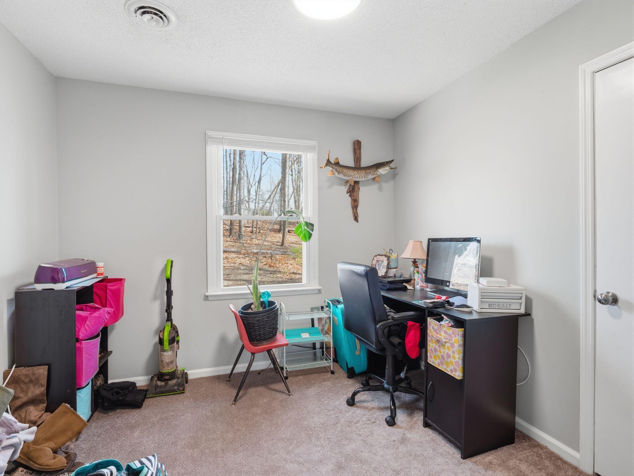 90 Fall Drive Collinsville, VA 24078 - Photo 16 of 22 a view of a workspace with furniture and a window