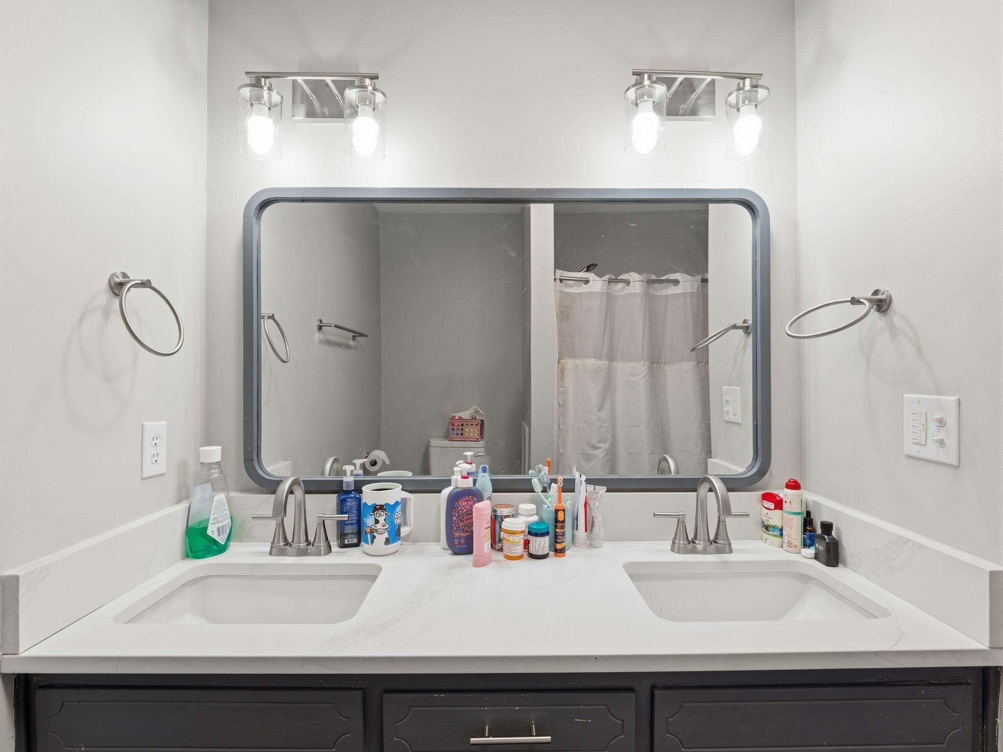 90 Fall Drive Collinsville, VA 24078 - Photo 19 of 22 a bathroom with a sink and a mirror