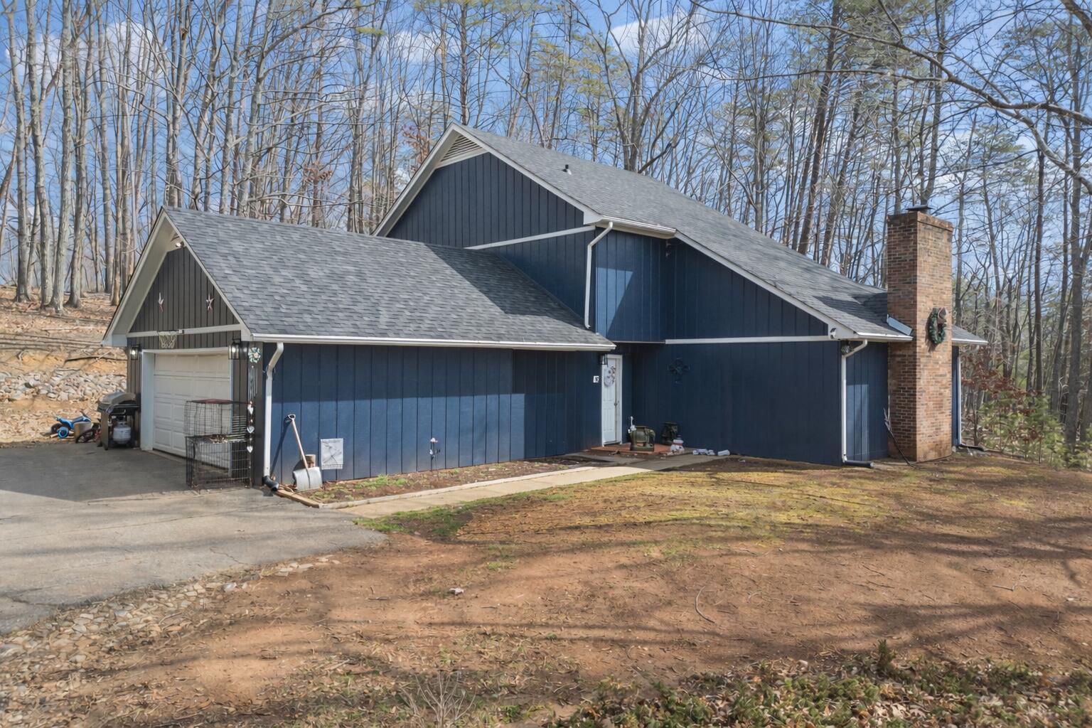 90 Fall Drive Collinsville, VA 24078 - Photo 2 of 22 a view of wooden house with a yard
