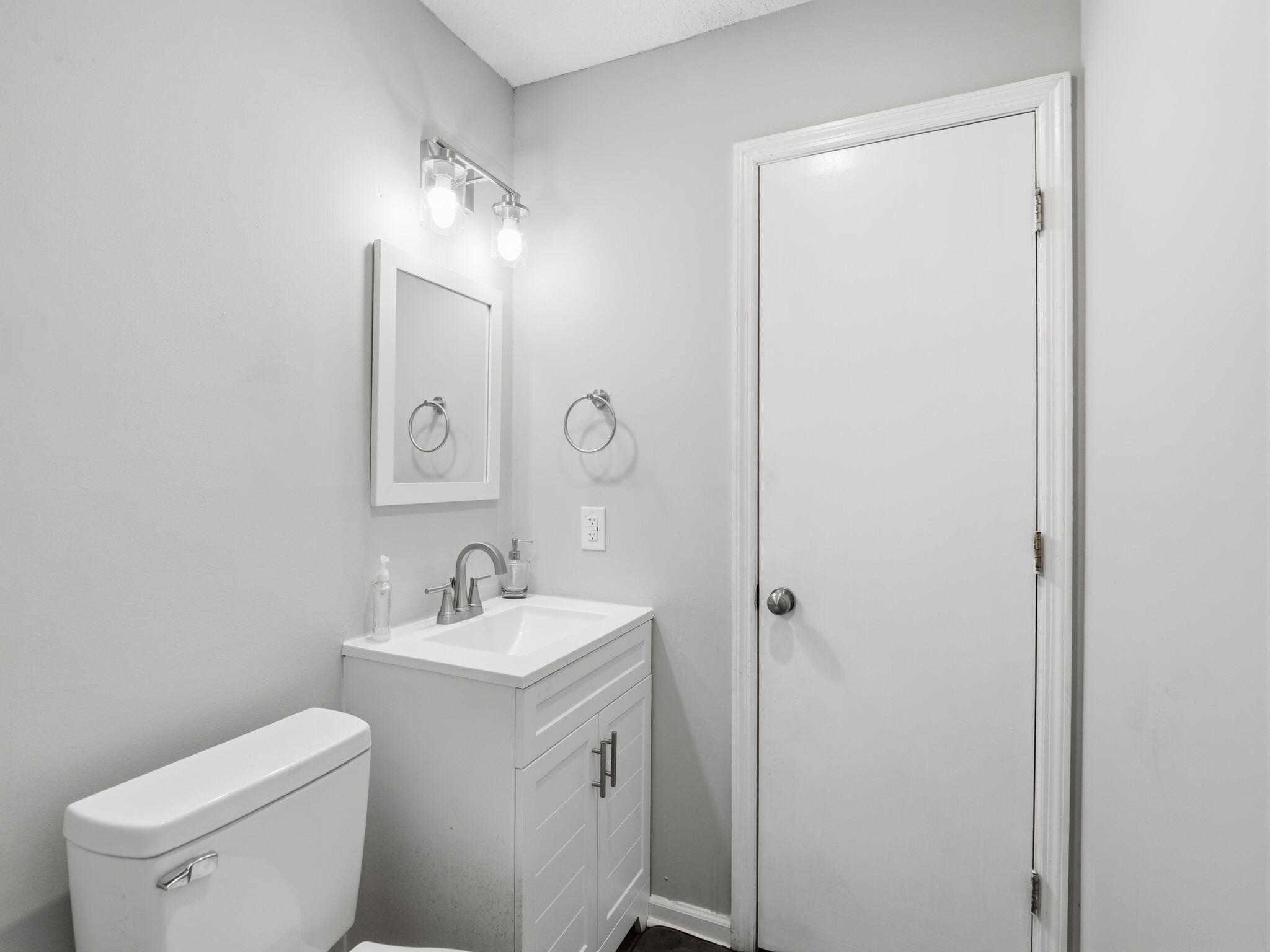 90 Fall Drive Collinsville, VA 24078 - Photo 21 of 22 a bathroom with a toilet sink and mirror