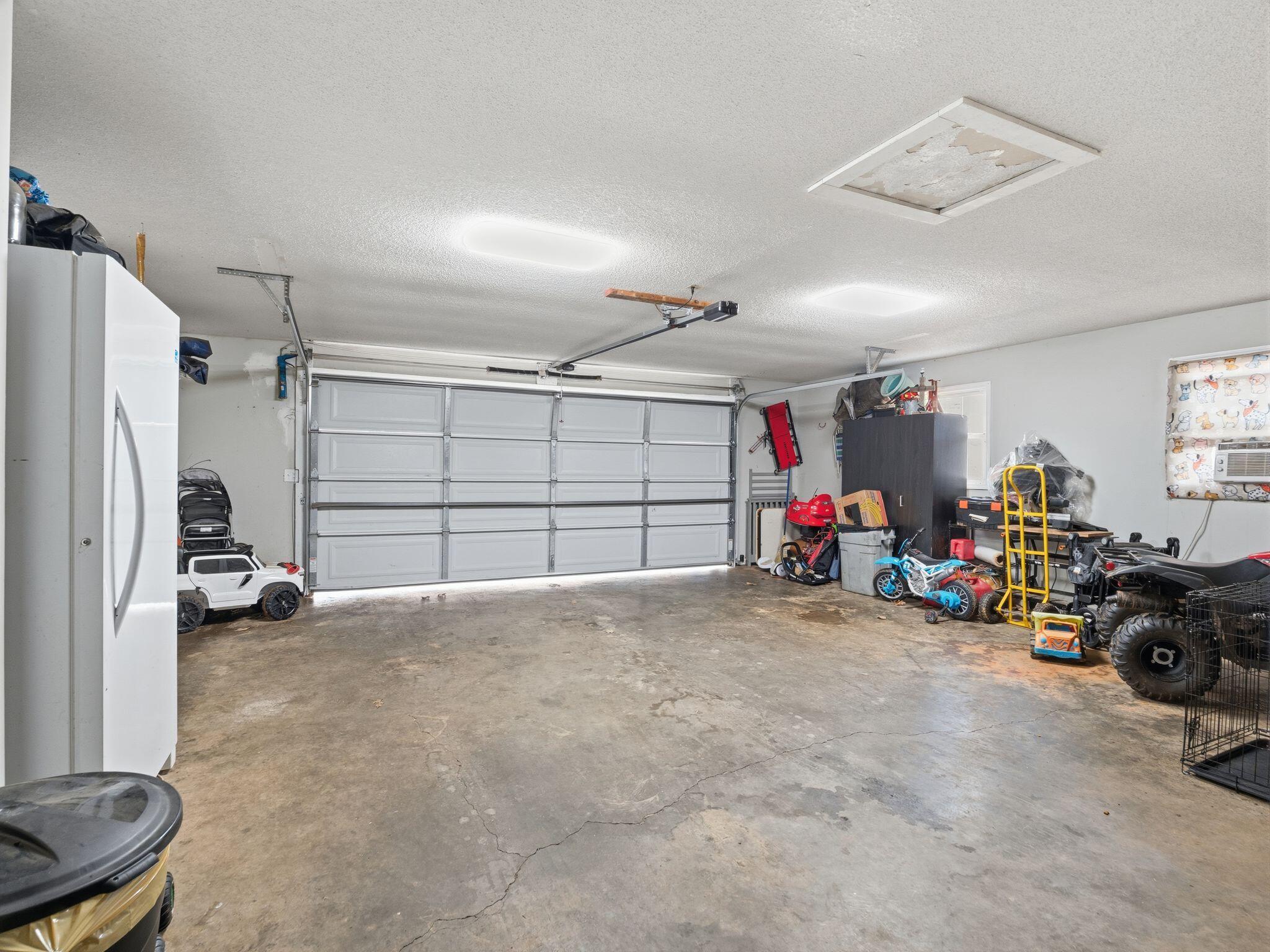 90 Fall Drive Collinsville, VA 24078 - Photo 22 of 22 a view of a garage with cars and a garage
