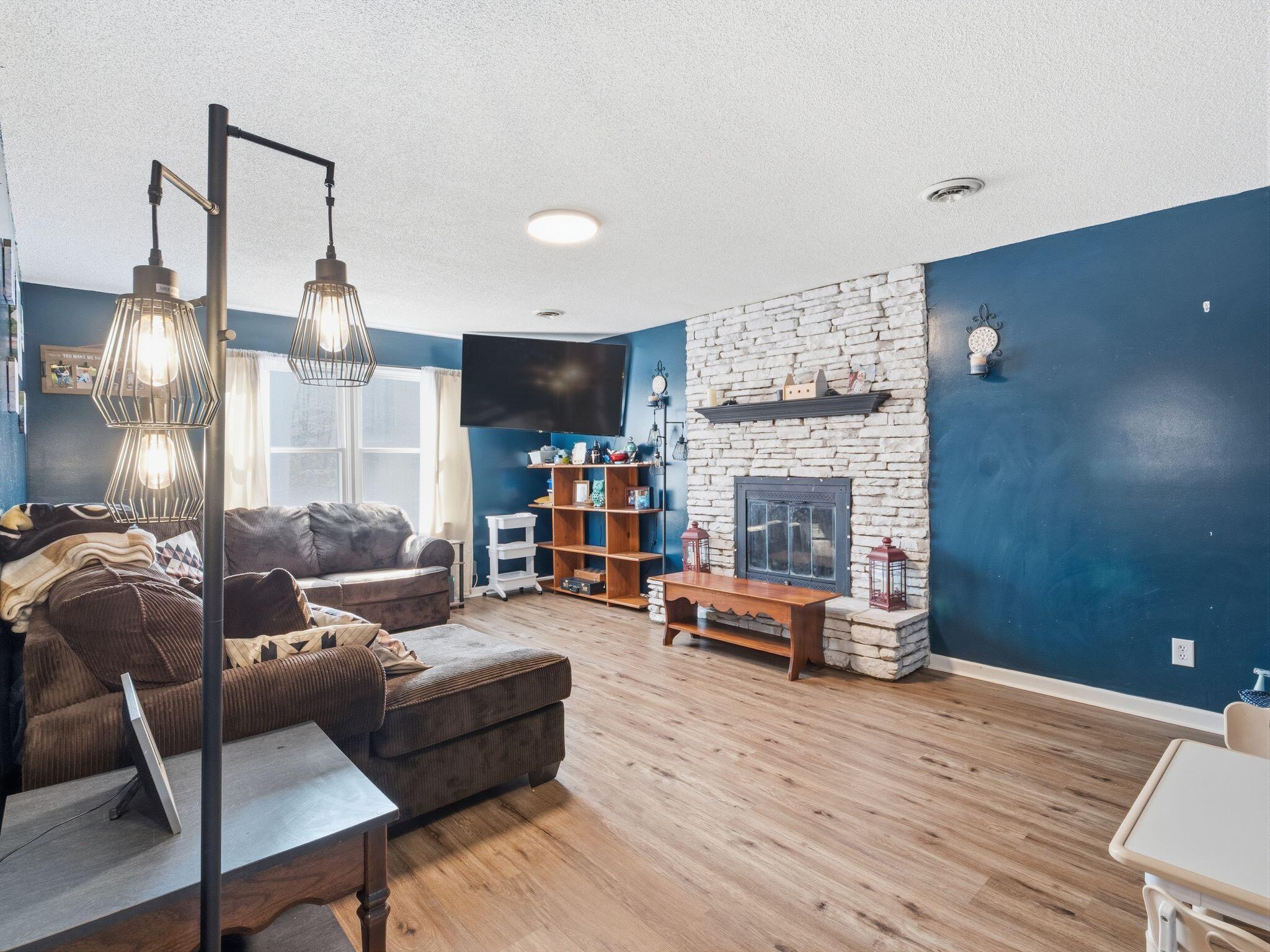 90 Fall Drive Collinsville, VA 24078 - Photo 5 of 22 a living room with furniture and a fireplace
