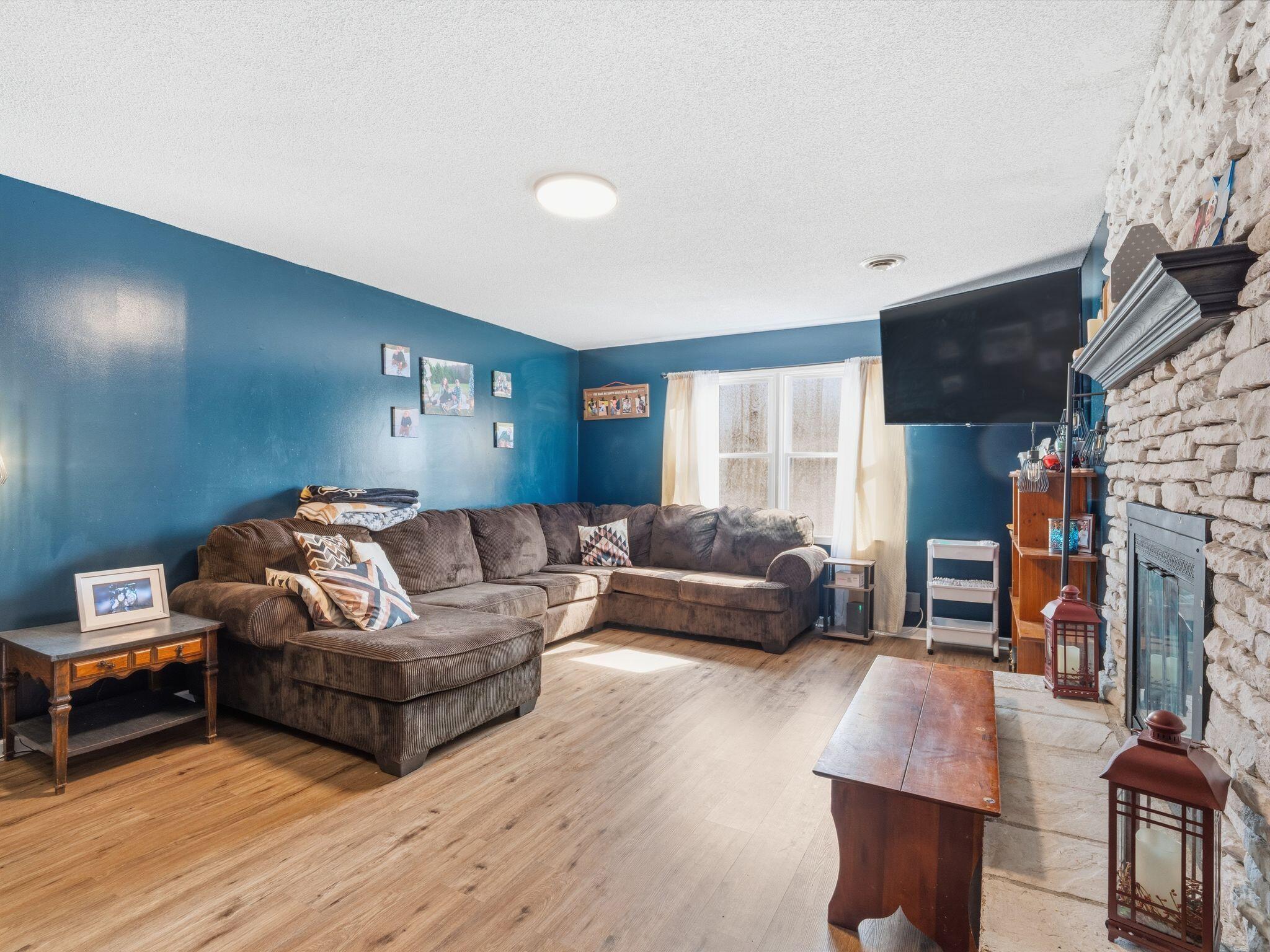90 Fall Drive Collinsville, VA 24078 - Photo 6 of 22 a living room with furniture and a fireplace