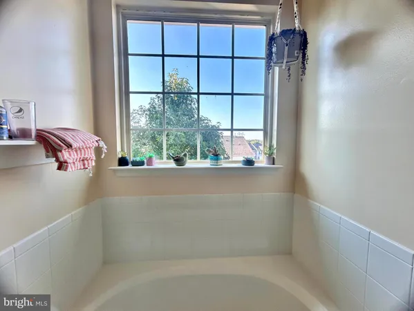 a bathroom with a glass shower door and a sink