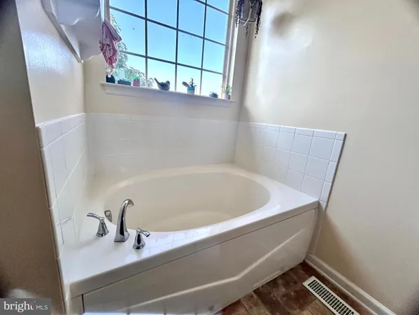 a bedroom with a bed and dresser