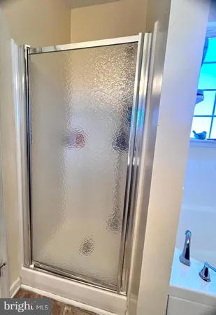 a bedroom with a bed and a television