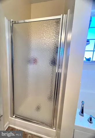 a bedroom with a bed and a television