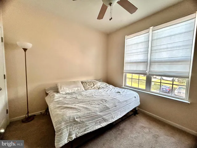 a bedroom with a bed and flat screen tv