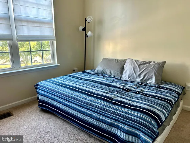 a view of a hallway with closet area