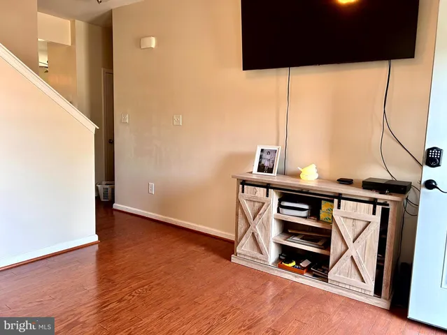 a view of an entryway with wooden floor