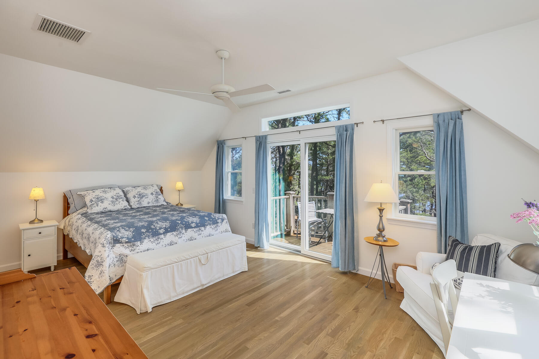 1075 3rd Avenue Wellfleet, MA 02667 - Photo 45 of 87 a bedroom with a large bed and a large window
