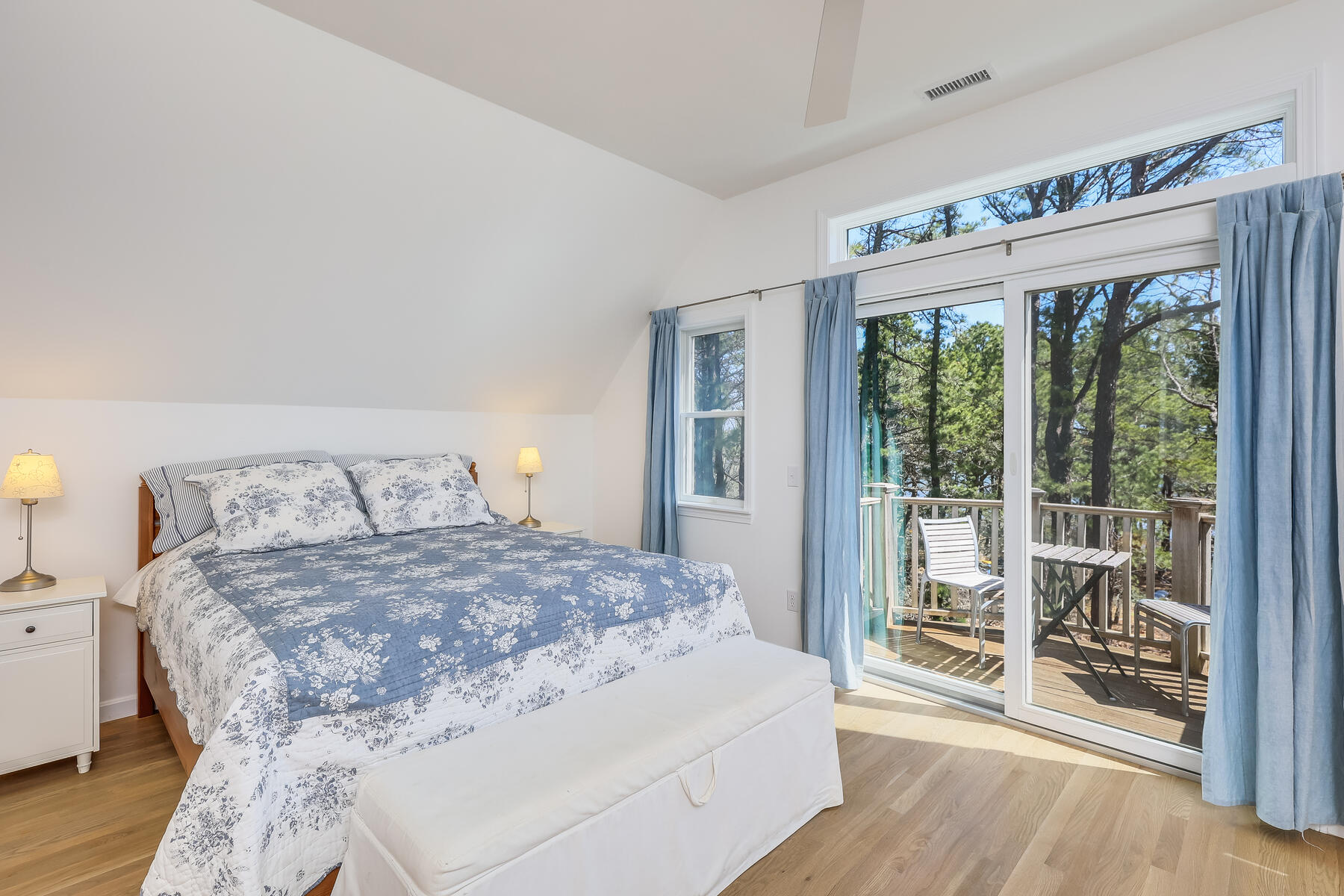 1075 3rd Avenue Wellfleet, MA 02667 - Photo 46 of 87 a bedroom with a large bed and a large window