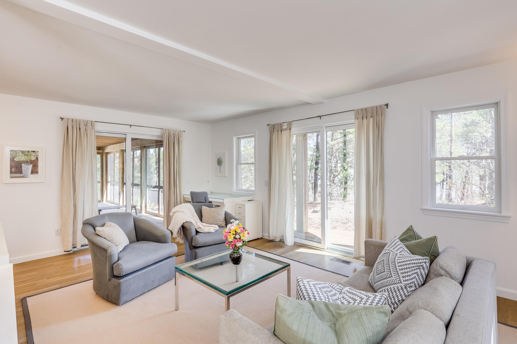 1075 3rd Avenue Wellfleet, MA 02667 - Photo 53 of 87 a living room with furniture and floor to ceiling windows