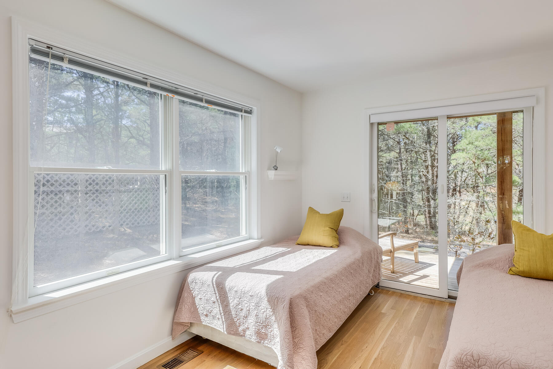 1075 3rd Avenue Wellfleet, MA 02667 - Photo 57 of 87 a bedroom with a large bed and a large window