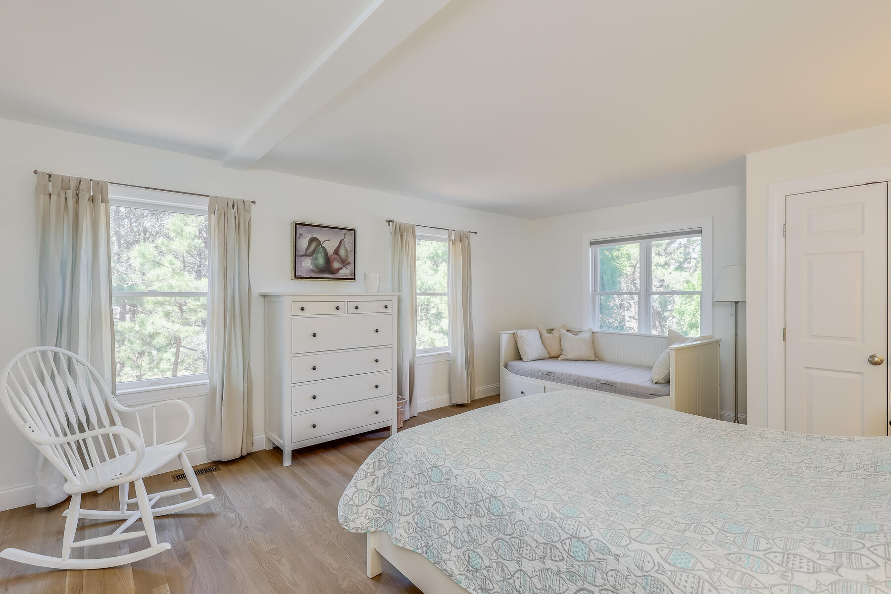 1075 3rd Avenue Wellfleet, MA 02667 - Photo 62 of 87 a bedroom with a bed and a chair