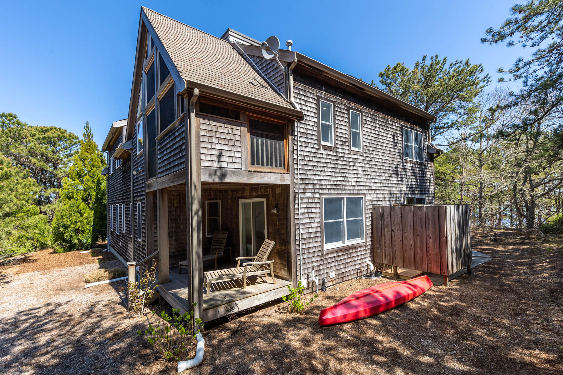 1075 3rd Avenue Wellfleet, MA 02667 - Photo 69 of 87 a view of a small house with yard