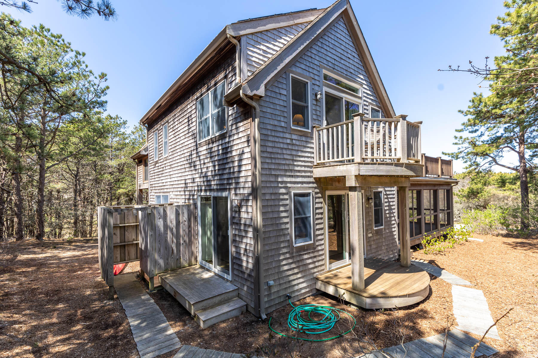1075 3rd Avenue Wellfleet, MA 02667 - Photo 80 of 87 a front view of a house with a yard