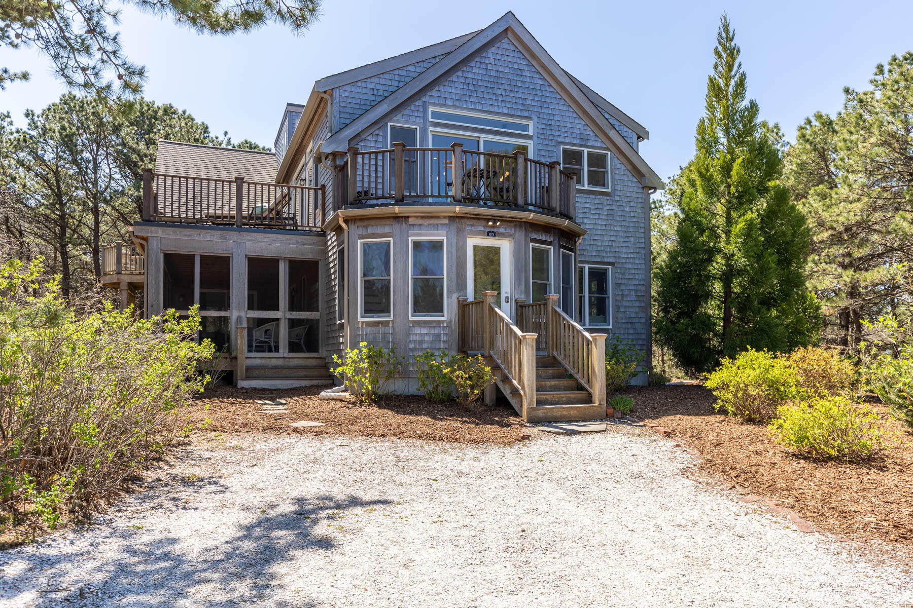 1075 3rd Avenue Wellfleet, MA 02667 - Photo 81 of 87 a front view of a house with a yard