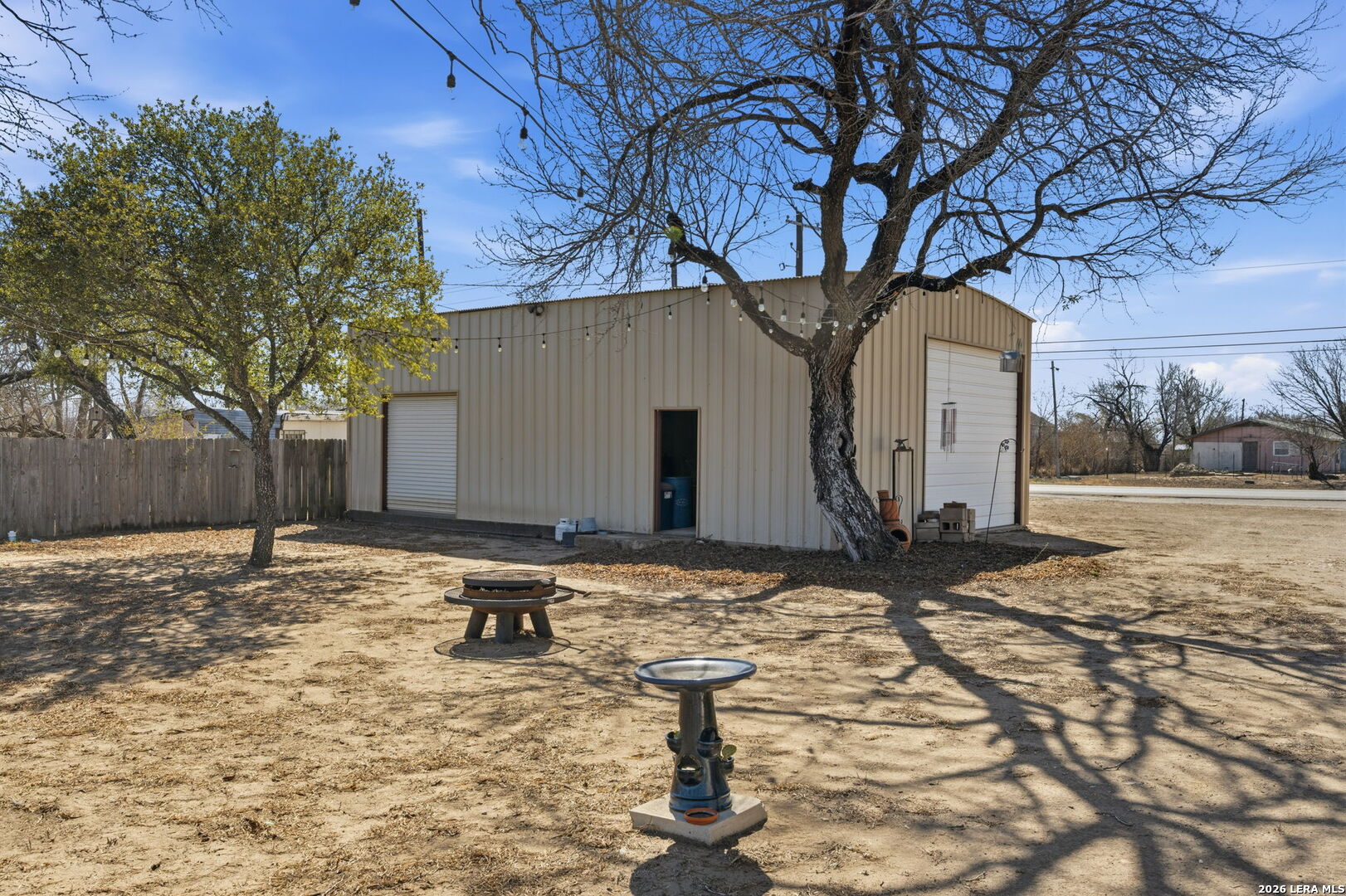708 Mesquite Street Jourdanton, TX 78026 - Photo 17 of 49 a backyard of a house with yard and garage