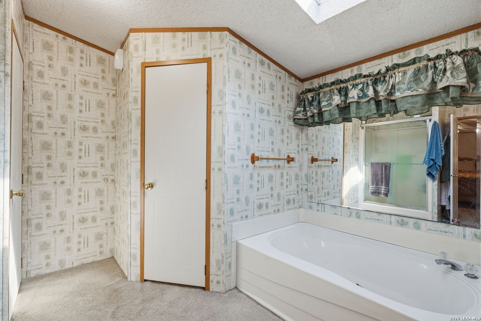 708 Mesquite Street Jourdanton, TX 78026 - Photo 24 of 49 a bathroom with a bathtub and a shower