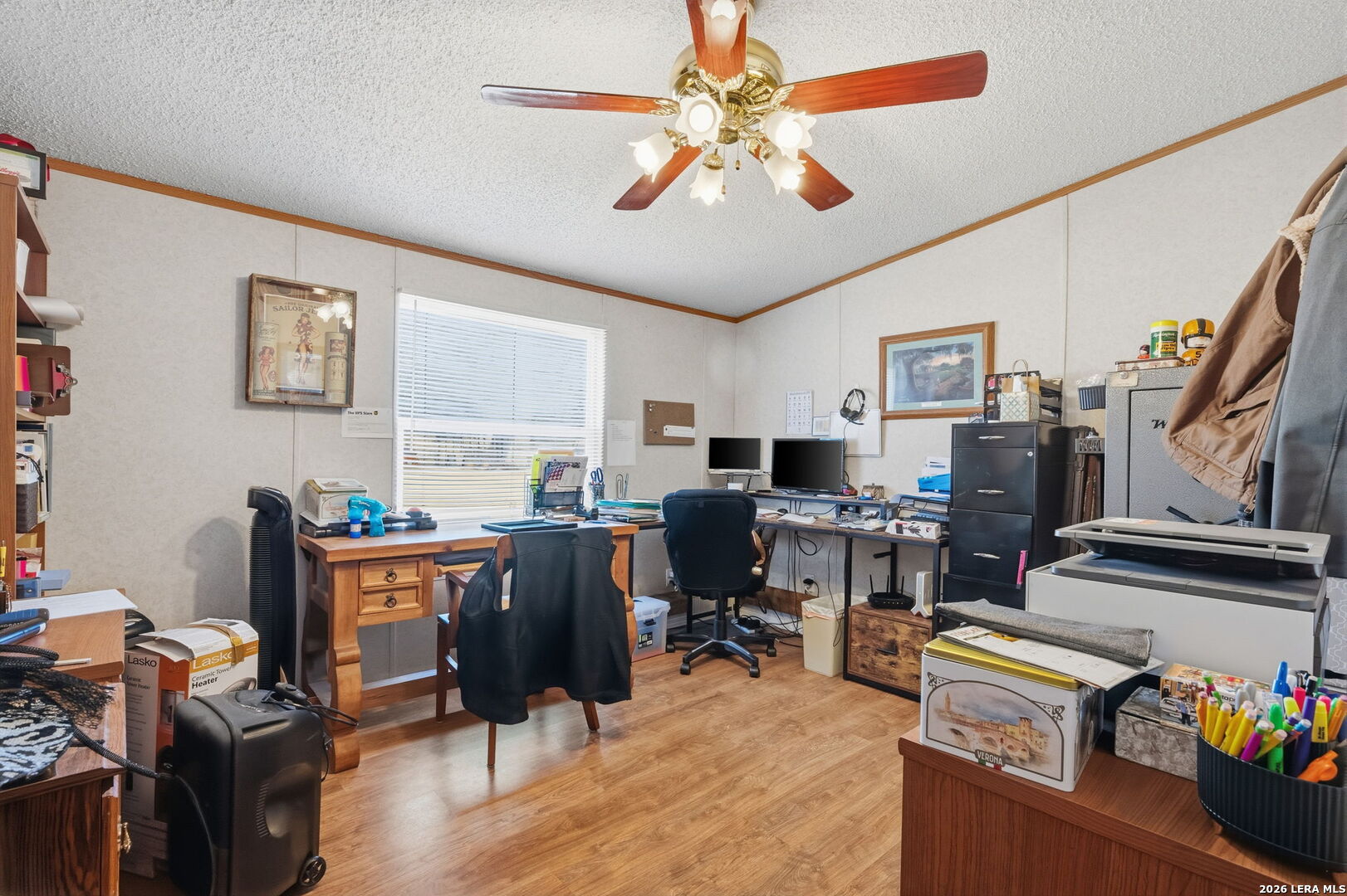 708 Mesquite Street Jourdanton, TX 78026 - Photo 26 of 49 a view of a workspace with furniture and a workspace