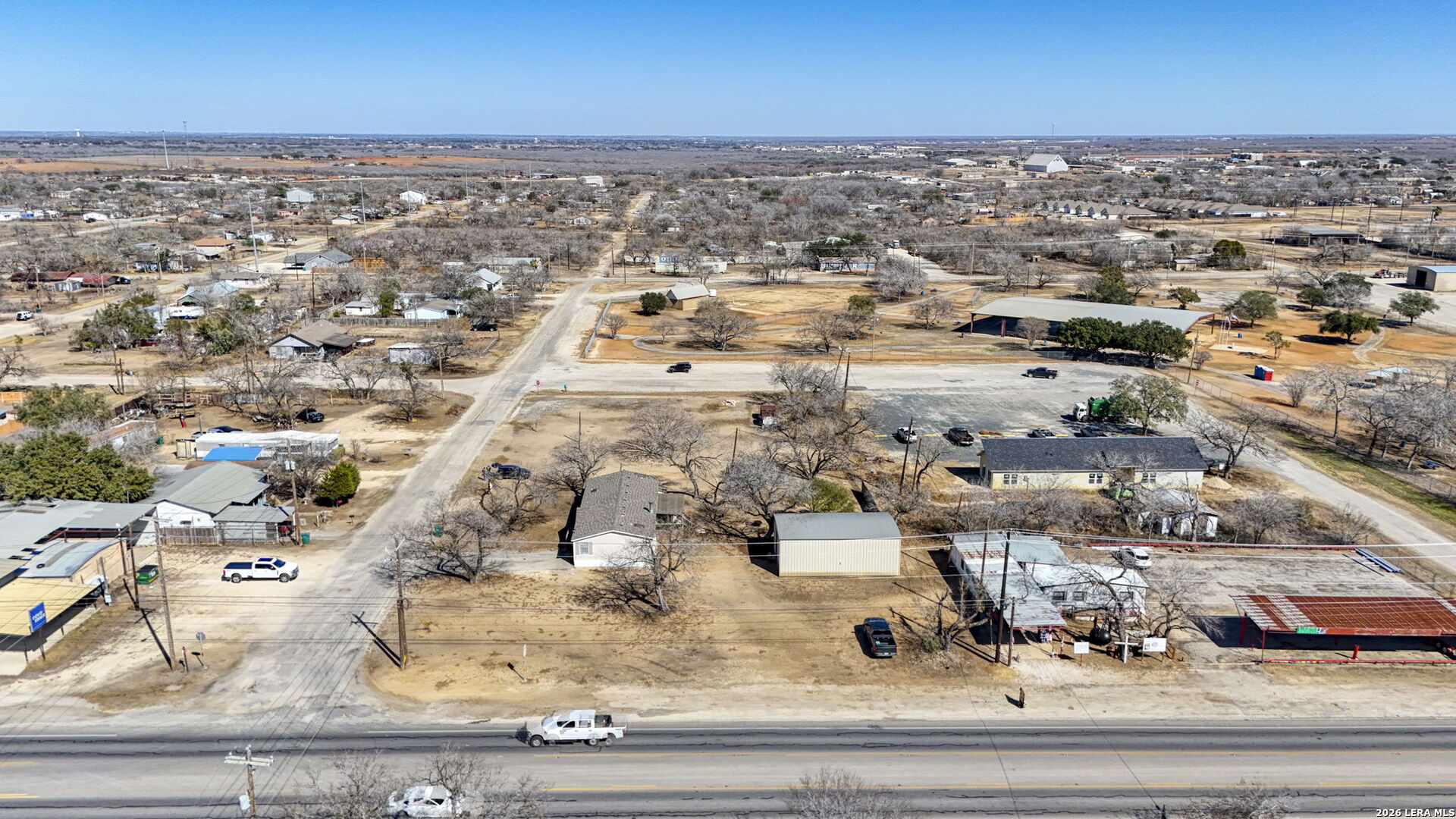 708 Mesquite Street Jourdanton, TX 78026 - Photo 40 of 49 an aerial view of residential houses with outdoor space