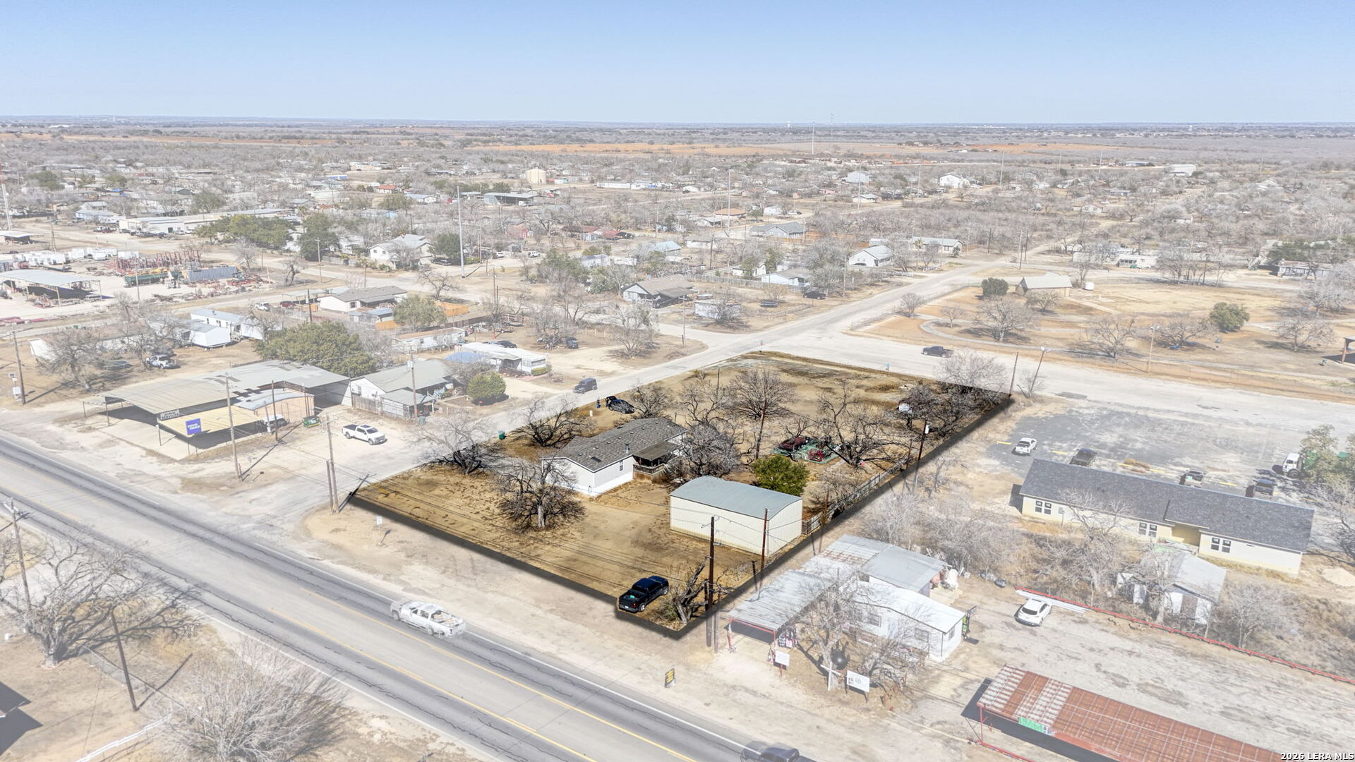 708 Mesquite Street Jourdanton, TX 78026 - Photo 41 of 49 an aerial view of residential houses with outdoor space