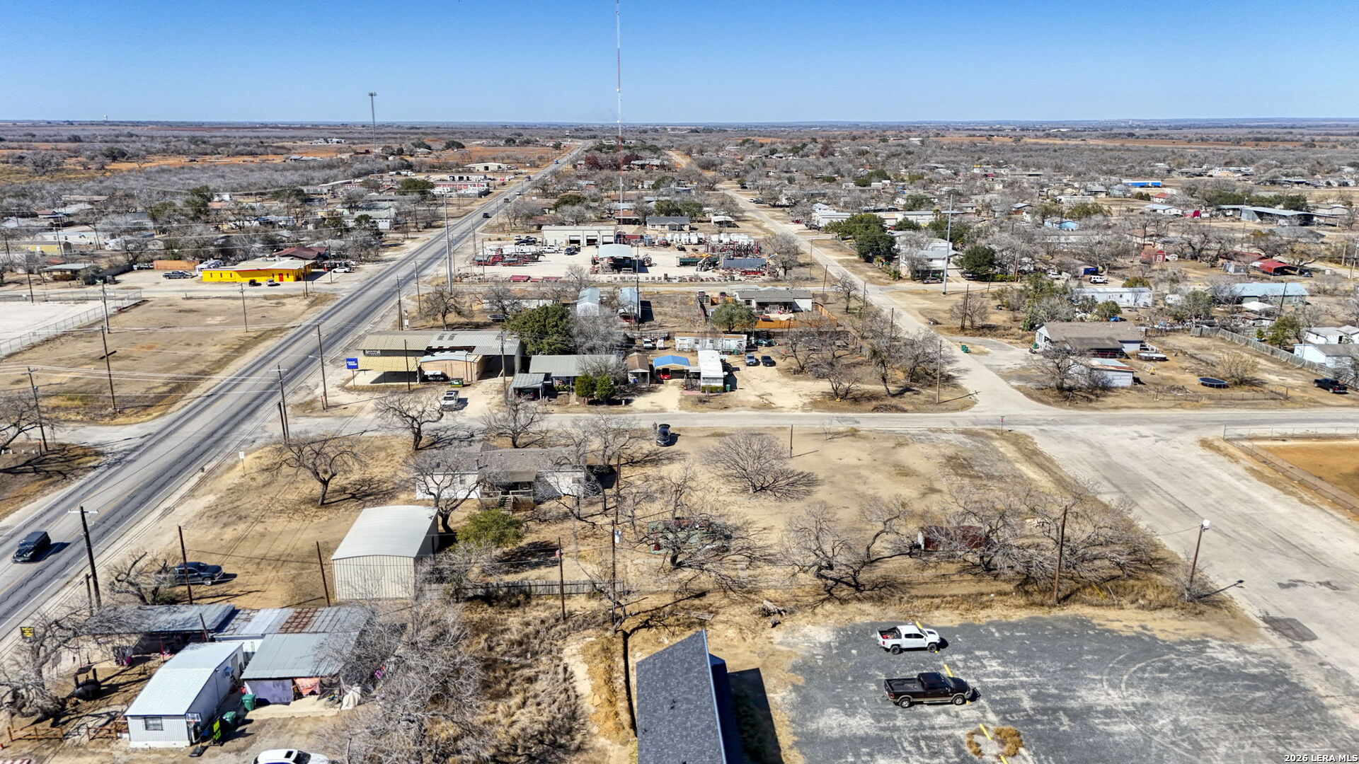 708 Mesquite Street Jourdanton, TX 78026 - Photo 44 of 49 an aerial view of residential houses with outdoor space